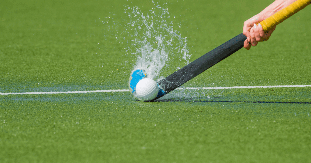Hockey Ball and Stick with Splashing Water