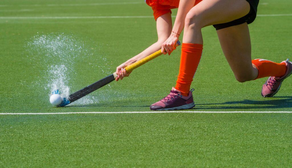 Hockey Female Player Passing to a team mate