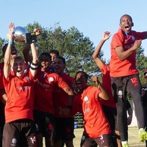Maritzburg College captain Mateo Horstead raises the Primo Big 10 trophy after College beat Glenwood for the title in July 2023.