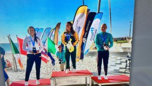 Clad in her South African tracksuit, Holly Smith is all smiles as she is recognised as the junior girls' world champion at the K1 Ocean Paddling World Championships.