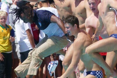 Bishops' coach Jabulani Sibiya takes a swim with the Western Province u19A team after leading them to the Inter-Provincial title in Gqeberha in December 2023.