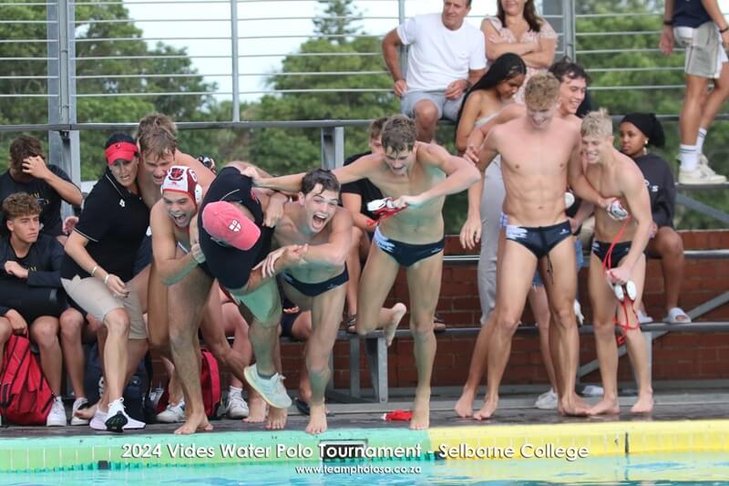 Clifton's water polo players take the champions' swim at the 2024 Vides Water Polo Tournament.