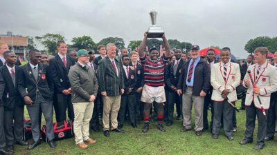 Why you play the game: for your school, for your team, and for yourself: Phiwayinkosi Kubheka holds the James Dwyer Memorial Trophy aloft after Maritzburg College's 18-7 win over Glenwood on 6 April.
