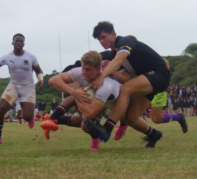 St Charles College captain Stefan Veldsman forces his way over the try line for Saints' third try against Clifton in a 36-12 win on 12 May 2024, in Durban. Photo: Brad Morgan.