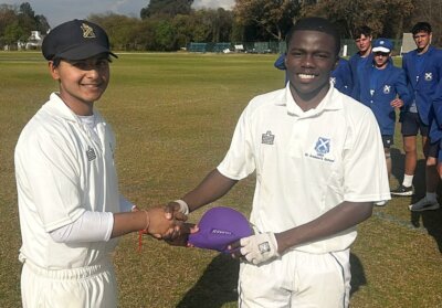 Dakalo Leketa (right), shown receiving a purple cap after capturing 13 wickets for St Andrew's against St David's, bowled the Bloemfontein boys to victory over King Edward VII (KES) in their second Fasken Time Cricket Festival match. Photo; St David's Marist Inanda on Facebook.