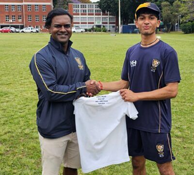 DHS 1st XI coach Fabian Lazarus presented captain Semal Pillay with a special shirt to celebrate his 50th match for the DHS 1st XI. Photo: DHS on Facebook.