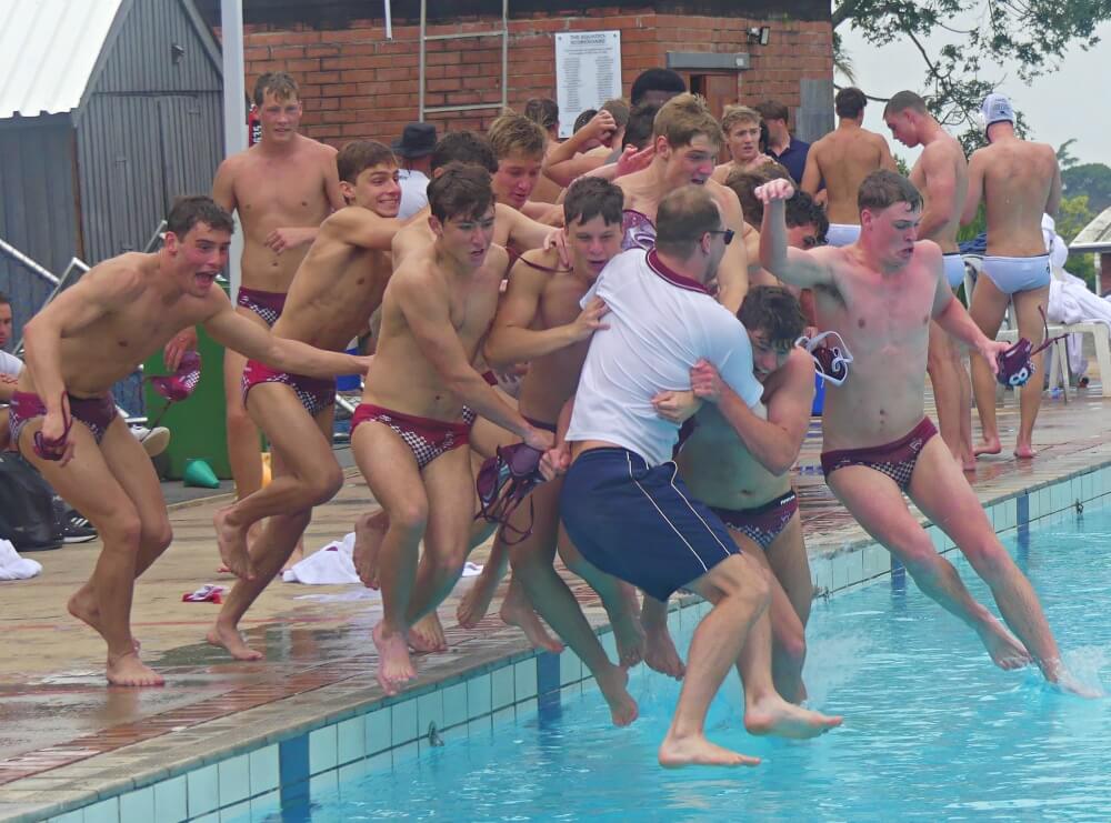 Kearsney College coach Nick Rodda is taken for a celebratory swim by his team after Kearsney clinched the 1st team title at the KZN Top 10 Water Polo Tournament. Photo: Brad Morgan.