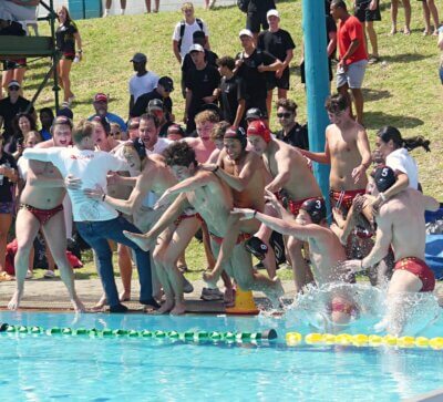 Coach Jon-Marc De Carvalho and his management team join the Central Gauteng u19 team for the winner's traditional swim after they clinched the Inter-Provincial title. Photo: Brad Morgan.