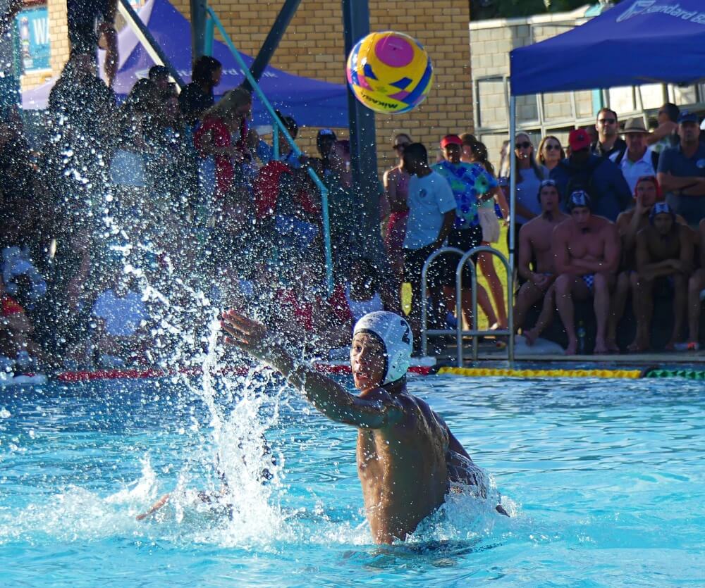 Strong defence from KZN's Matt Lortan deflects a Western Province shot away from goal. Photo: Brad Morgan.