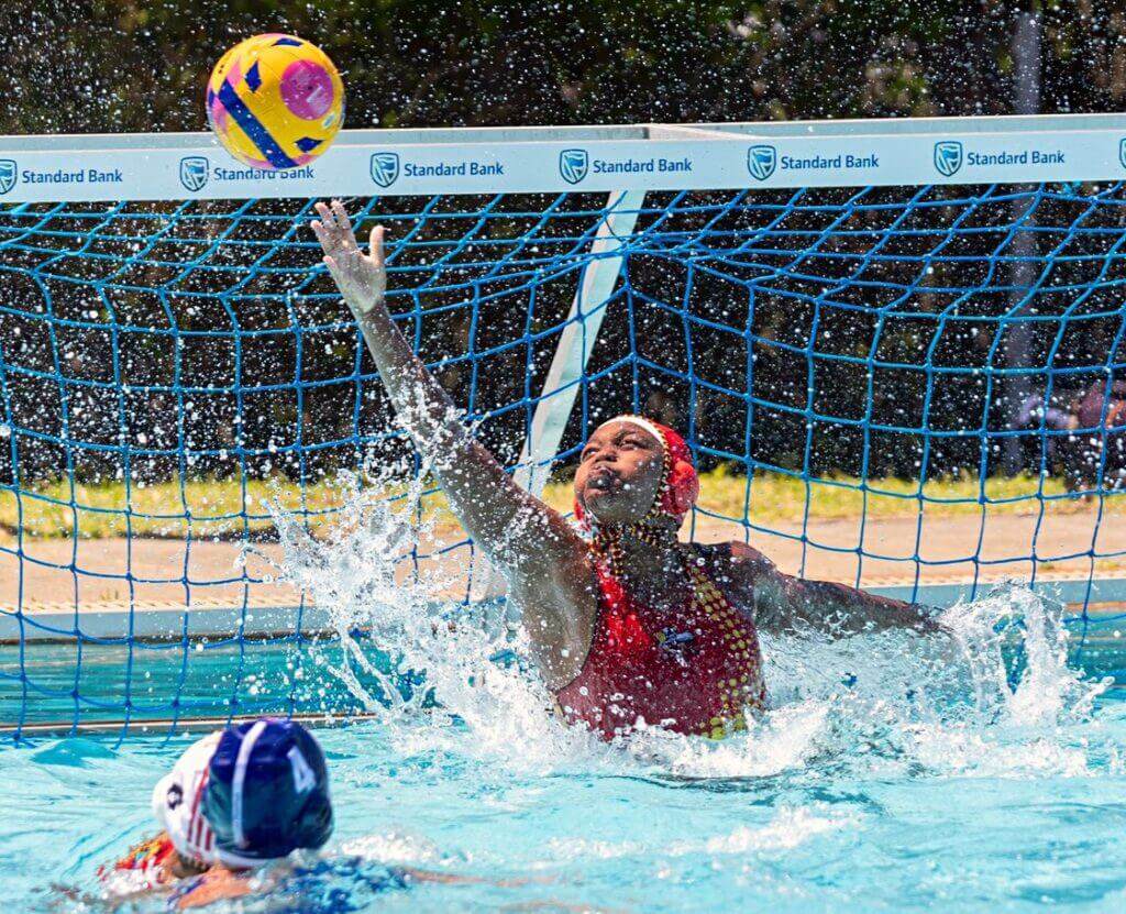 Kuhle Zulu stretches high to pull off a save for the Central Gauteng u16 team at the Schools Water Polo South Africa Inter-Provincial Tournament in East London in December 2024. Photo: Will Morrell.