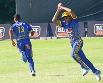 Durban High School's fielders rejoice after grabbing an early wicket against Hoërskool Waterkloof. Photo: Brad Morgan.