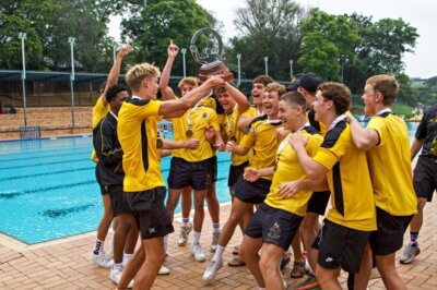 To the victors go the spoils! St David's lifts the Reef Cup. Photo: Debbi Adcock Photography.