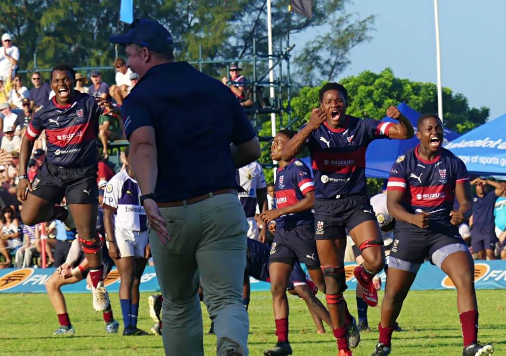 Westville's players turn towards coach Zander Erasmus in delight after the final whistle sounded to give them a hard-fought 16-14 victory over Northwood.
