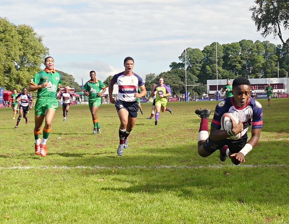 Speed merchant Avumile Lisa rounds off a spectacular range try for Westville against Rustenburg. Photo: Brad Morgan.