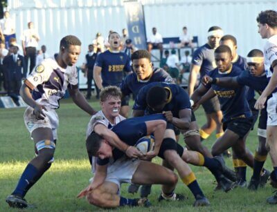 Sharks' no. 8, Jamie Wimble, shown making a tackle for orthwood against DHS, is a hard-hitting tackler and a dynamic presence on attack. Photo: Brad Morgan.