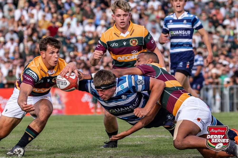 Paarl Boys' High lock Gershom Pieters powers his way through two tackles to score a try for Boishaai in their dramatic two-point win over Paarl Gimnasium. Photo: Anton Wannenburg/PhotoStories.