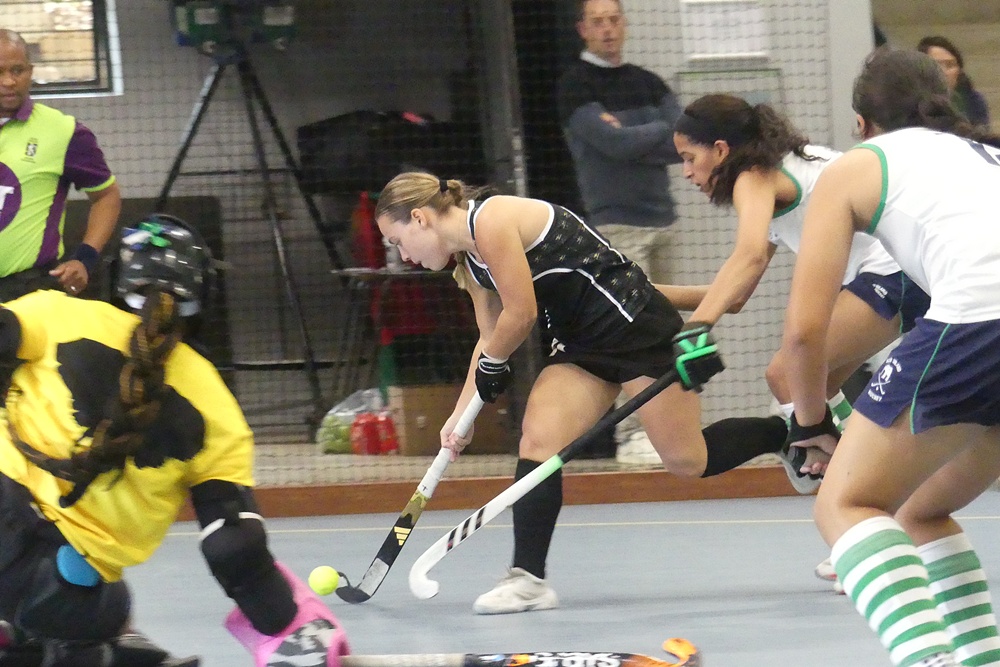 Codie Bestbier is challenged as she attempts to get a shot off in KZN Coastal A's 3-1 win over KZN Inland A on Wednesday morning at Thomas More College. Photo: Brad Morgan.
