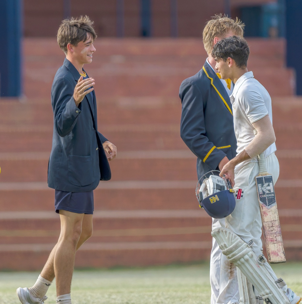 DHS opener Ismaeel Omar is congratulated by his teammates after scoring an unbeaten century in School's win over Hilton College. Photo: Justin Waldman Sports Photography.