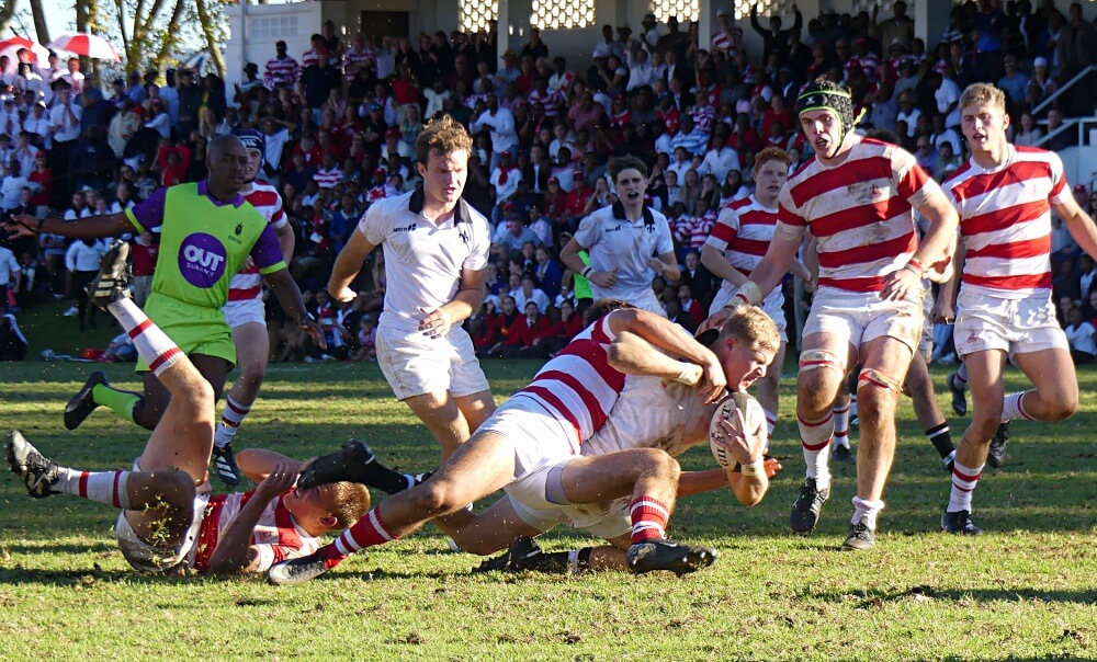 Guy Fender is dragged down just metres short of the Michaelhouse try line in the last minute of the game. Photo: Brad Morgan.