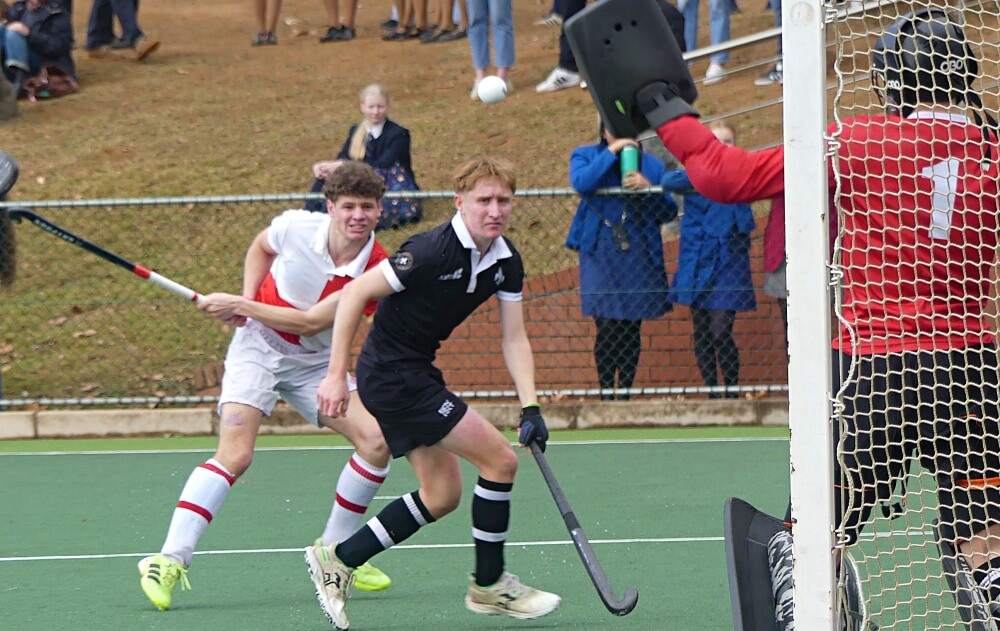Henry Yeadon, who scored one of Michaelhouse's three goals, and Ben Wilson, the scorer of Hilton's goal, watch a shot from Yeadon as it heads towards goal. Photo: Brad Morgan.