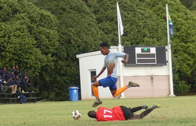 Amukelwa Khuzwayo beats the goalkeeper on his way to scoring Carter High's fourth goal against Edendale in the final of the Jody Momplé FA Cup. Photo: Brad Morgan.