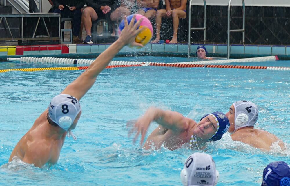 Hilton College's Bradley van Loggerenberg blocks a shot by Northwood's Tristan Parkinson in a thrilling contest that Hilton won 12-11. Photo: Brad Morgan.