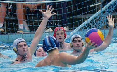 SACS' Finn Lecuona prepares to shoot as Reddam House Constantia's defenders pack the shooting lane in the seventh-place playoff at the Clifton Water Polo Tournament. Photo: Brad Morgan.
