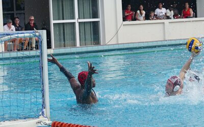 Clifton College's Executive Headmaster Adams Rogers (third from left) watches his school seal victory in the U19 final with a breakaway goal after blocking a Hilton shot. Photo: Brad Morgan.