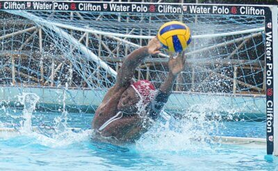 Hilton College goalkeeper Lwango Ntantala dives full length in a vain attempt to stop a Clifton shot on goal. Photo: Brad Morgan.